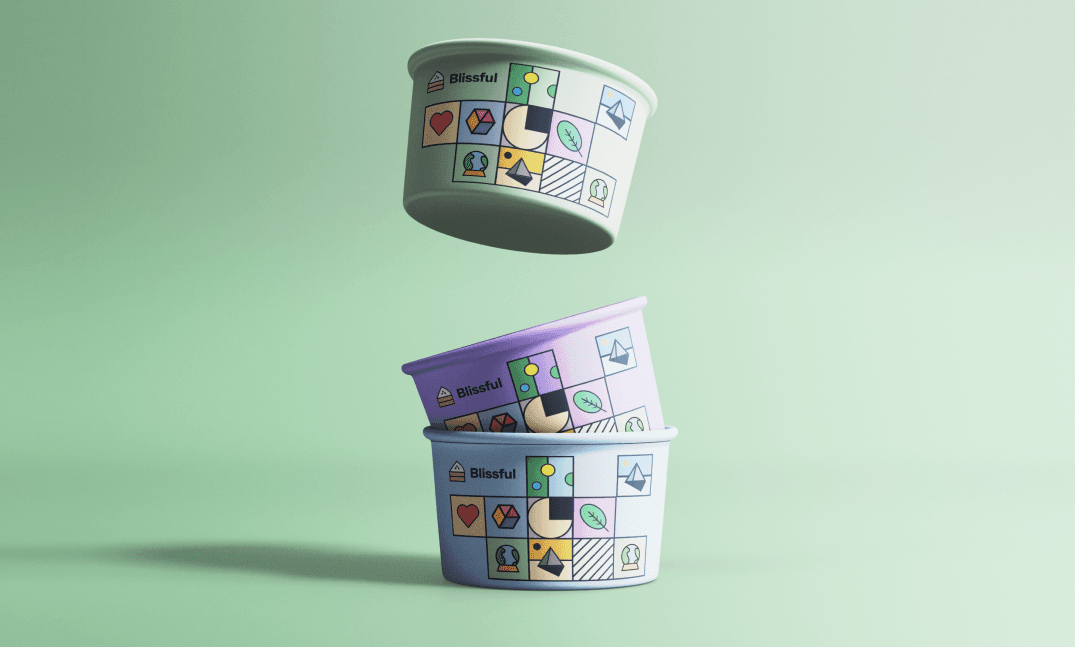 Three dessert bowls in sage, lilac and blue, stacked, each wrapped in tiles.