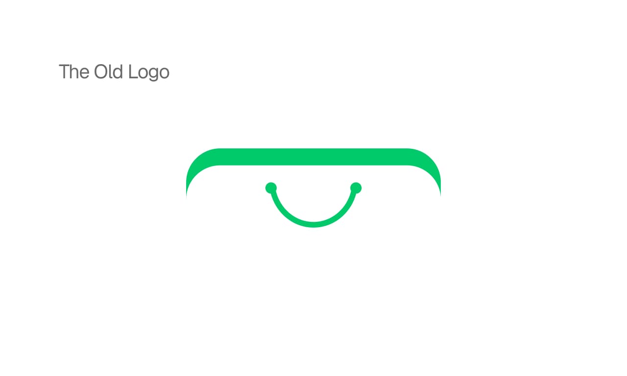 The old Shopino logo: a green smile hanging under the curved top of a bag.